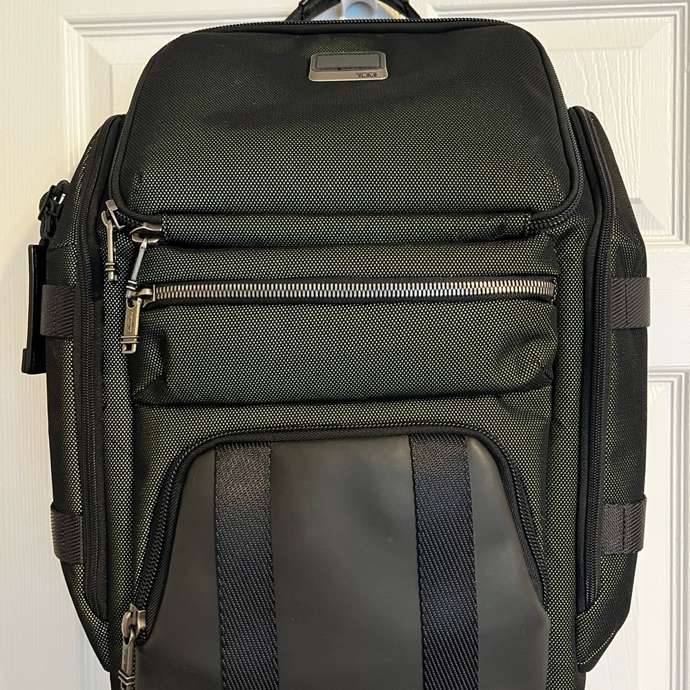 Tumi travel backpack. Like new mint condition in dark green